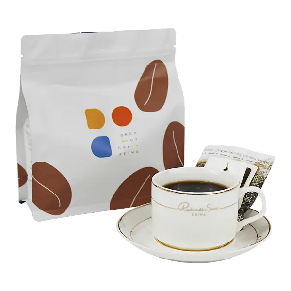 Brewed drip coffee beside retail drip coffee box